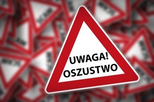 Znak ostrzegawczy z napisem Uwaga Oszustwo