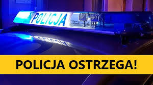 światła radiowozu i napis policja ostrzega